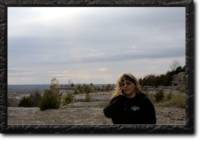 Couple with their bike, wife helping husband up